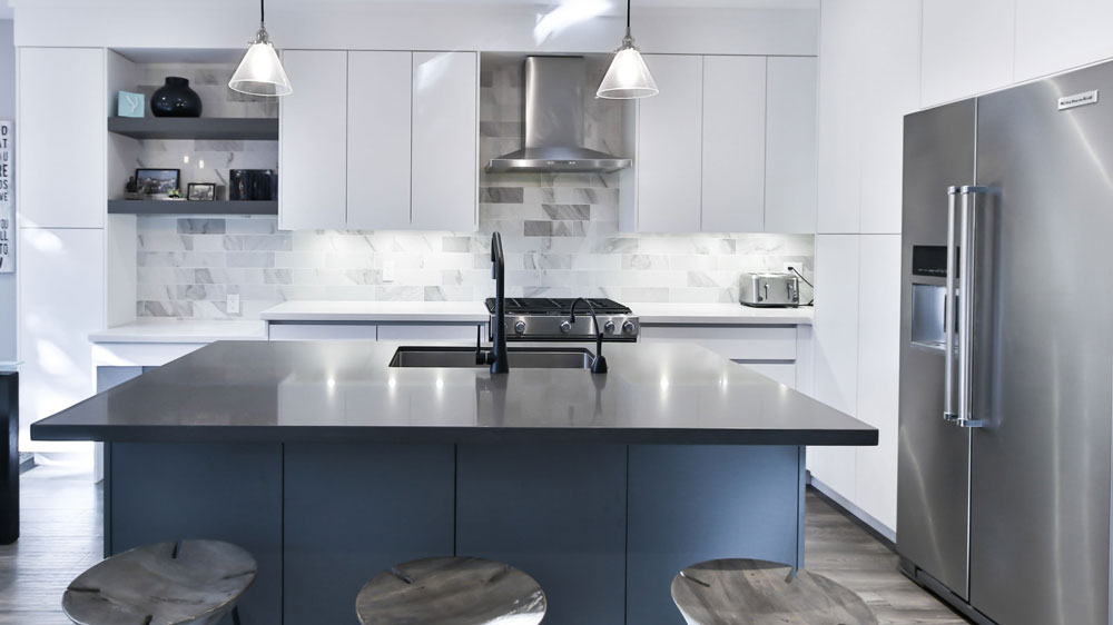 Sleek, modern kitchen with large KitchenAid refrigerator